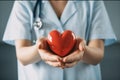 Medicine doctor holding red heart shape in hand, Medical heart cardiology concept Royalty Free Stock Photo