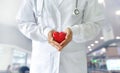 Medicine doctor holding red heart shape, medical techno Royalty Free Stock Photo