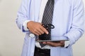 Medicine doctor holding stethoscope and working with modern tablet computer - Medical technology concept. Royalty Free Stock Photo