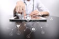 Medicine doctor with modern computer, virtual screen interface and icon medical network connection. medical concept. Royalty Free Stock Photo
