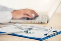 Medicine doctor`s working table. Focus on stethoscope. Royalty Free Stock Photo