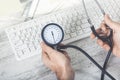 Medicine doctor`s working table view from top. Keyboard, mouse and stethoscope lying on table at physician`s office Royalty Free Stock Photo