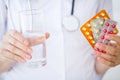 Medicine. Doctor woman holding blister pack pills Royalty Free Stock Photo