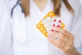 Medicine. Doctor woman holding blister pack pills Royalty Free Stock Photo