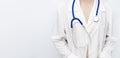 Medicine doctor woman in white coat with stethoscope. Healthcare and medical concept. Banner with copyspace. Royalty Free Stock Photo