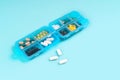 Medicine dose box. Prescription pills and vitamins in a blue pill box Royalty Free Stock Photo