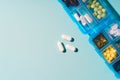 Medicine dose box. Prescription pills and vitamins in a blue pill box. Royalty Free Stock Photo