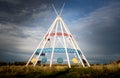 He world`s tallest tepee standing under a dramatic sky next to the Trans Canada Hiway i