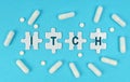 On a blue background, there are pills and puzzles with the inscription - ITCH