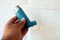 Medicine and health concept: Blue inhaler Royalty Free Stock Photo