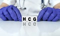 The doctor put together a word from cubes HCG. Human Chorionic Gonadotropin