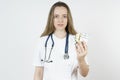 Medicine and health concept. Doctor woman holds pills in hands Royalty Free Stock Photo