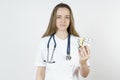 Medicine and health concept. Doctor woman holds pills in hands Royalty Free Stock Photo