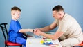 Medicine and health. small boy with dad play. pediatrician intern. nurse laboratory assistant. happy child with father Royalty Free Stock Photo