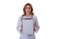 Medicine, healthcare, charity and people concept - smiling female doctornurse showing empty blank clipboard sign with copy space Royalty Free Stock Photo