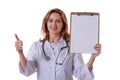 Medicine, healthcare, charity and people concept - smiling female doctornurse showing ok sign and empty blank clipboard Royalty Free Stock Photo