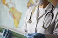 Medicine, healthcare concept - close-up of a young female doctor in blue gloves holding a medical report on the background of a Royalty Free Stock Photo