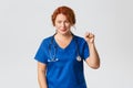 Medicine, healthcare and coronavirus concept. Hopeful and optimistic medical worker showing stay united gesture, clench