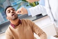 Doctor examining patient throat at clinic