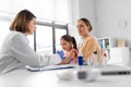 mother vaccinating her little daughter at clinic Royalty Free Stock Photo