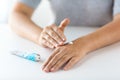 Close up of hands with cream or therapeutic salve