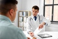 Doctor giving prescription to patient at hospital Royalty Free Stock Photo