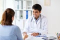 Doctor giving prescription to patient at hospital Royalty Free Stock Photo