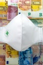 Medicine mask and money bills Royalty Free Stock Photo