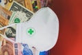 Medicine mask and money bills Royalty Free Stock Photo