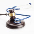 Medicine and medical symbols - close up shot of a judge gavel and a stethoscope