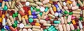 Medicine, medication. Colorful pills and capsules background, banner Royalty Free Stock Photo