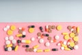 Medicine multicolor pills on colorful background closeup with space for text