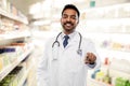 Smiling indian male doctor pointing finger to you Royalty Free Stock Photo