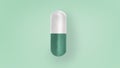 Medicine pill on green background, virus infections prevention and protection concept