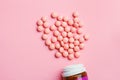 Medicine pills and bottle on pastel background, top view, copy space, flat layout