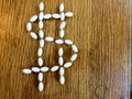 Medicine pills making dollar sign