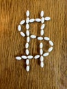 Medicine pills making dollar sign