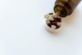 Medicine and pills. Medicines on a white background close-up. Brown glass bucket with capsules inside on a white Royalty Free Stock Photo