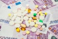 Medicine pills over euro banknotes. Covid-19 coronavirus pills are on the euro banknote. The concept of insurance Royalty Free Stock Photo