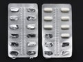 Medicine pills in packs pills in aluminum blister pack capsules. Some new and some empty from used Royalty Free Stock Photo