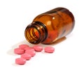 Medicine pills spilling from a bottle Royalty Free Stock Photo