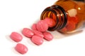 Medicine pills spilling from a bottle Royalty Free Stock Photo