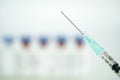 Medicine plastic vaccination with needle was filling with coronavirus vaccine in the hospital. Blur background is vaccine vial.
