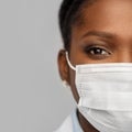 African american female doctor in facial mask Royalty Free Stock Photo