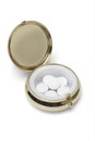 Medicine in round metal pill container Royalty Free Stock Photo