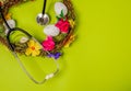 Medicine stethoscope with Easter eggs on spring green background. Easter card with copy space Royalty Free Stock Photo