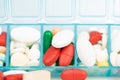 Medicine tablet and capsule in weekly pill box Royalty Free Stock Photo