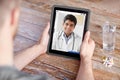 Patient having video chat with doctor on tablet pc Royalty Free Stock Photo