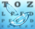 Medicine and vision concept - contact lenses on eyesight test chart