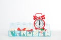 Medicine in weekly pill box and red alarm clock Royalty Free Stock Photo